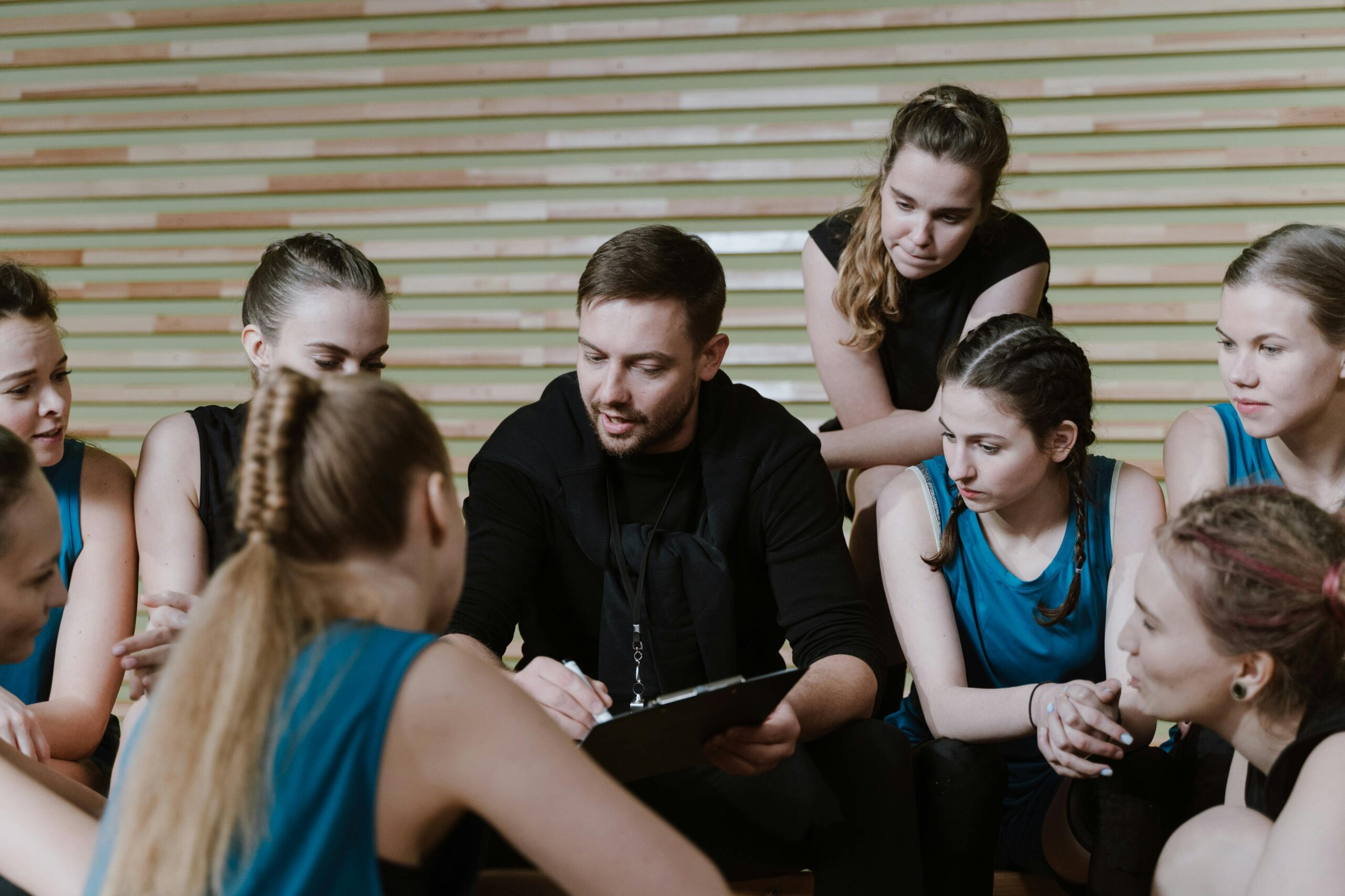 Coach discussing strategy with team.