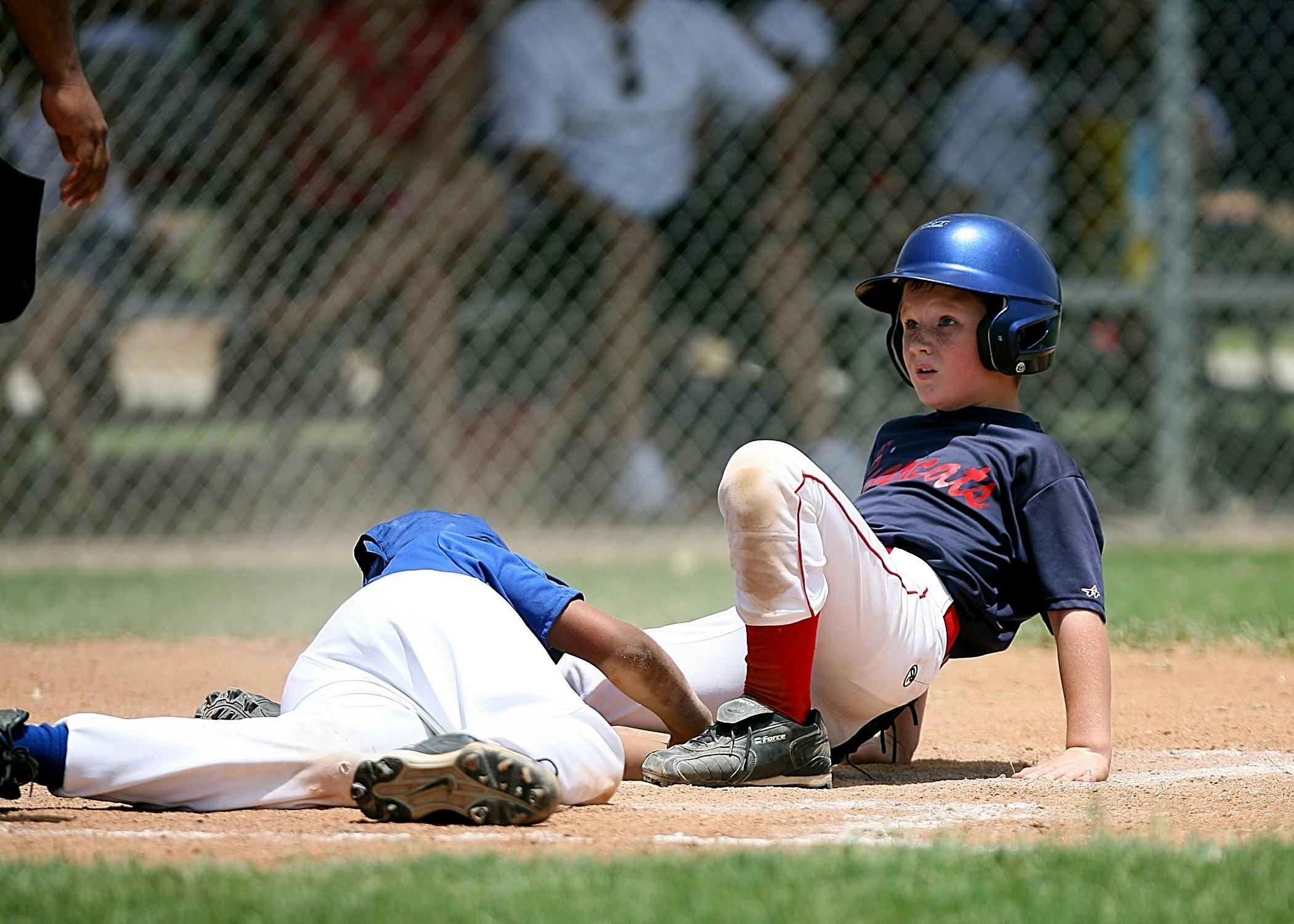 Baseball players in action on field.