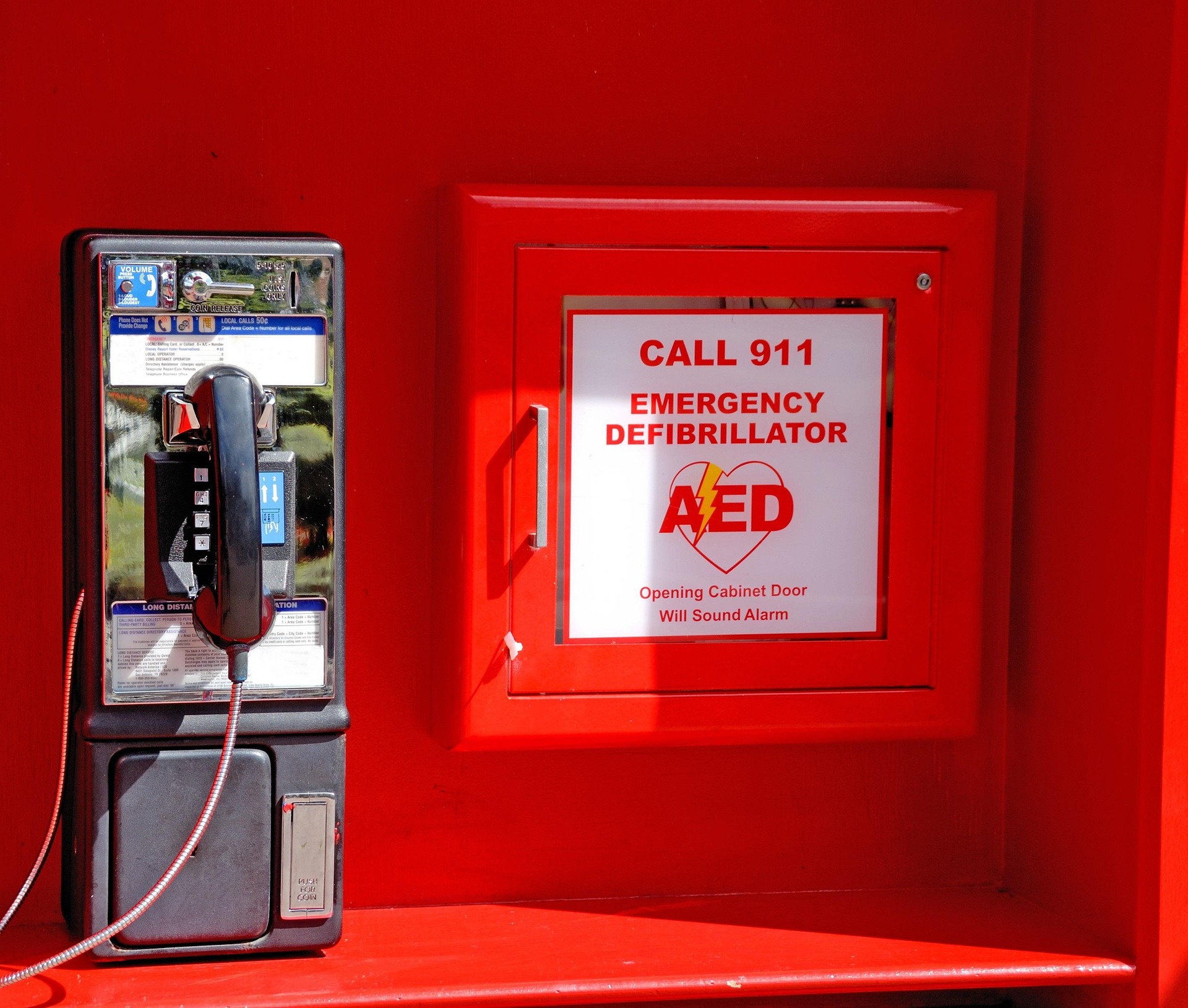 Public phone and defibrillator cabinet